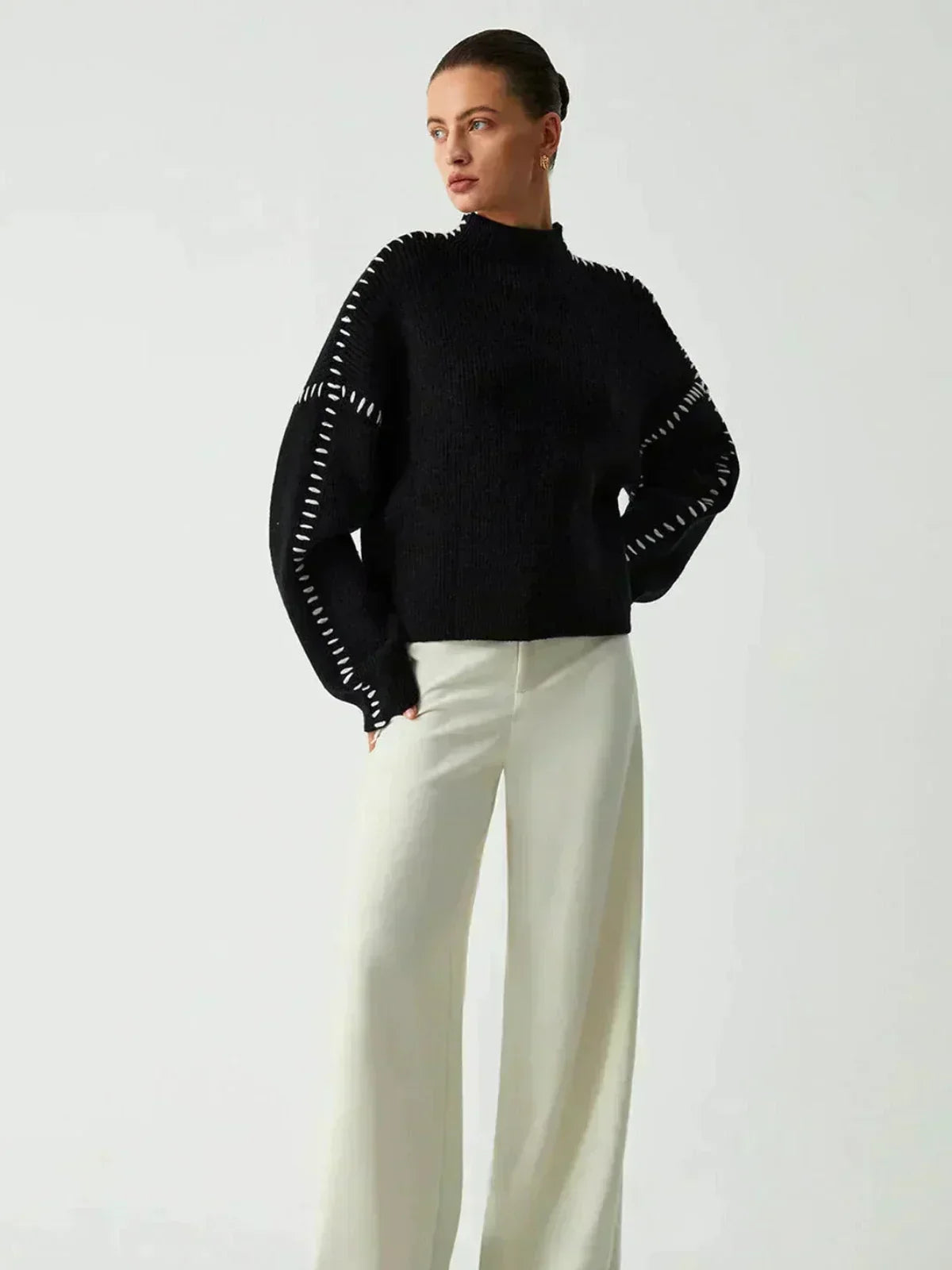 Nina ribstrikket sweater med høj hals fra Elsebeth København, set bagfra